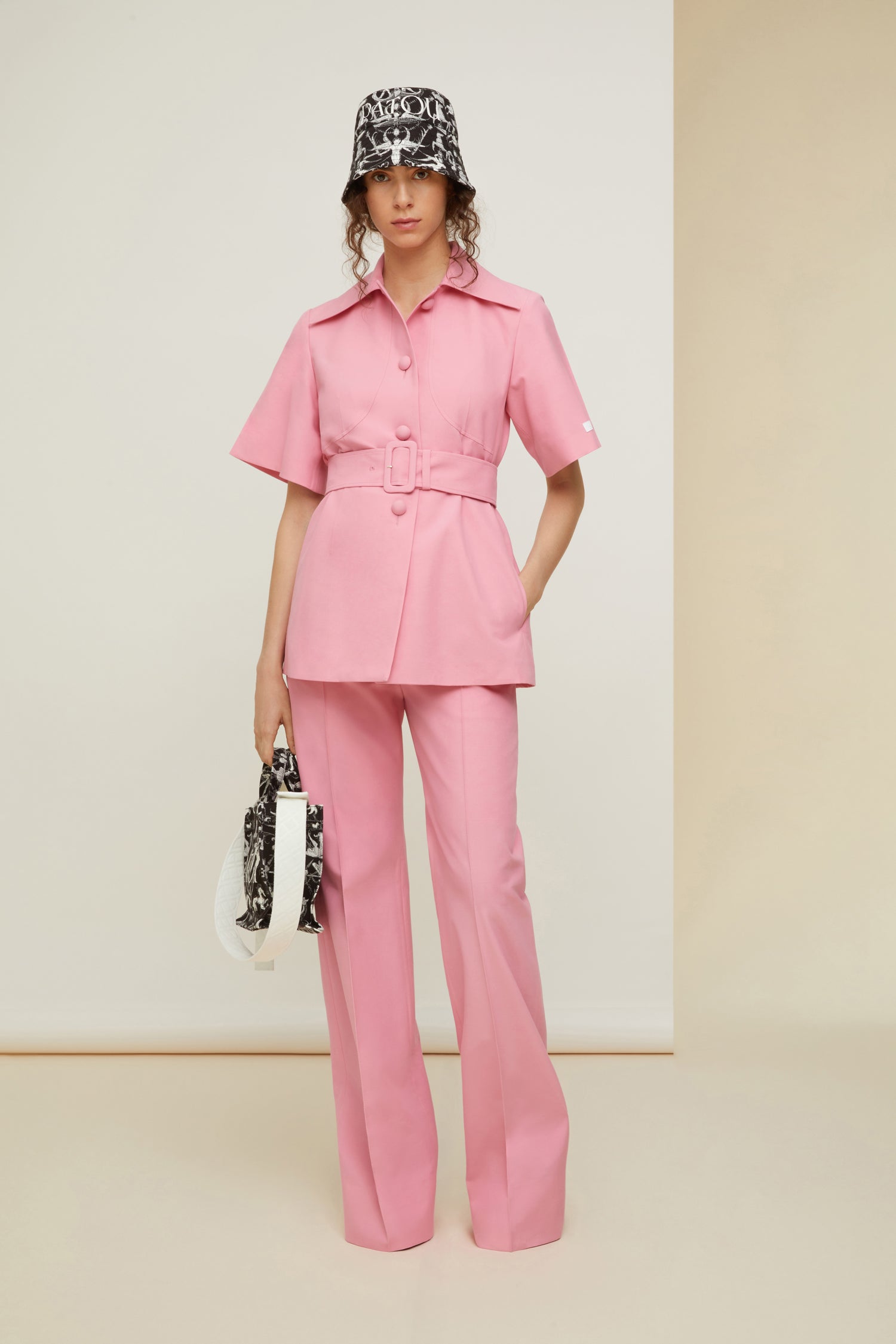 Patou - Long tailored trousers in organic cotton and wool - Rose - Flawless and carefree: tailoring by Patou.  Rose pink organic cotton and wool canvas trousers. Long straight leg. Fastens via a single JP-engraved button and zip at the front. Belt loops. Pockets at the sides. Signature curved seam and darts at the back.