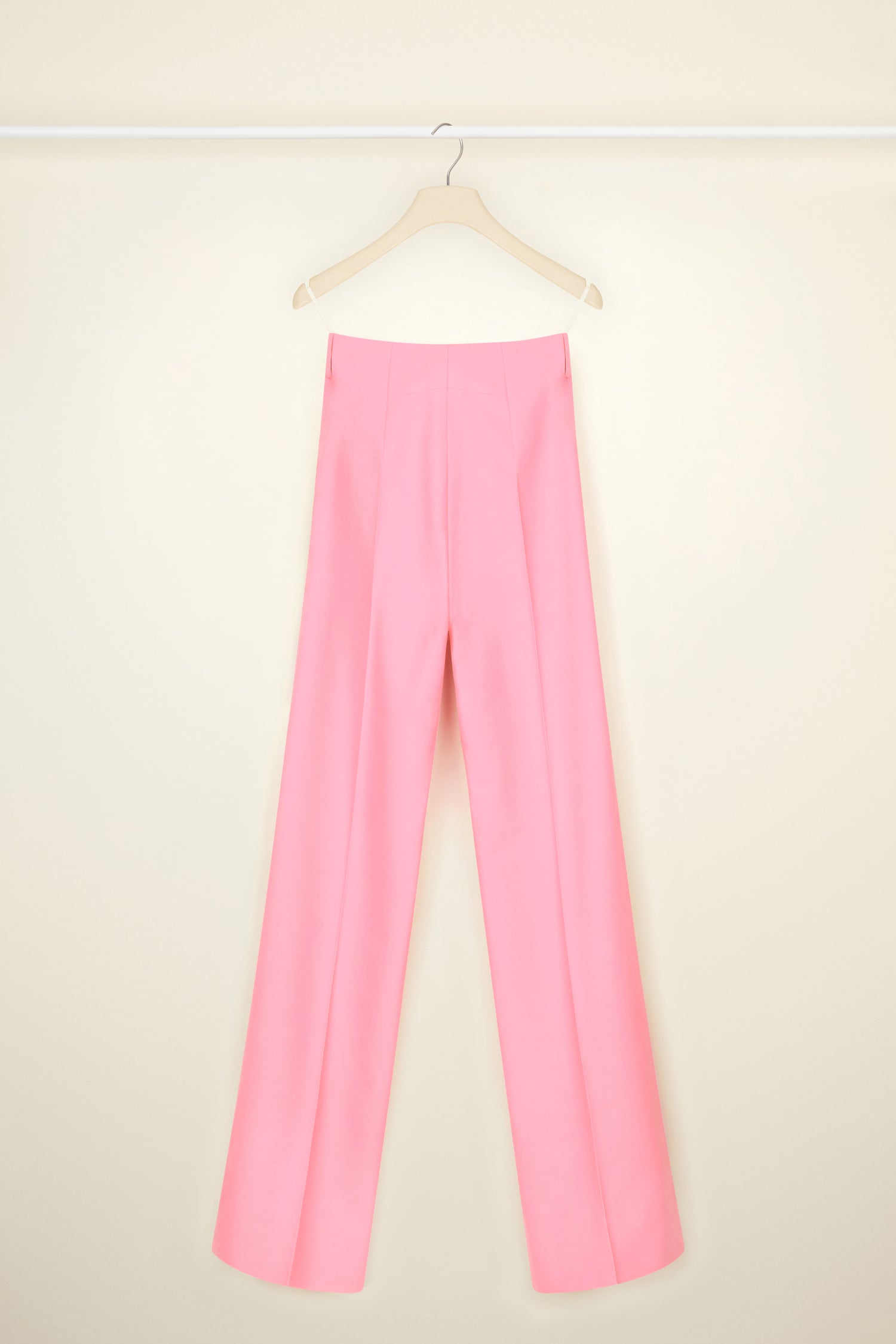 Patou - Long tailored trousers in organic cotton and wool - Rose - Flawless and carefree: tailoring by Patou.  Rose pink organic cotton and wool canvas trousers. Long straight leg. Fastens via a single JP-engraved button and zip at the front. Belt loops. Pockets at the sides. Signature curved seam and darts at the back.