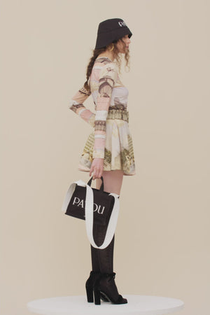 Belted pleated mini skirt in printed organic cotton and wool