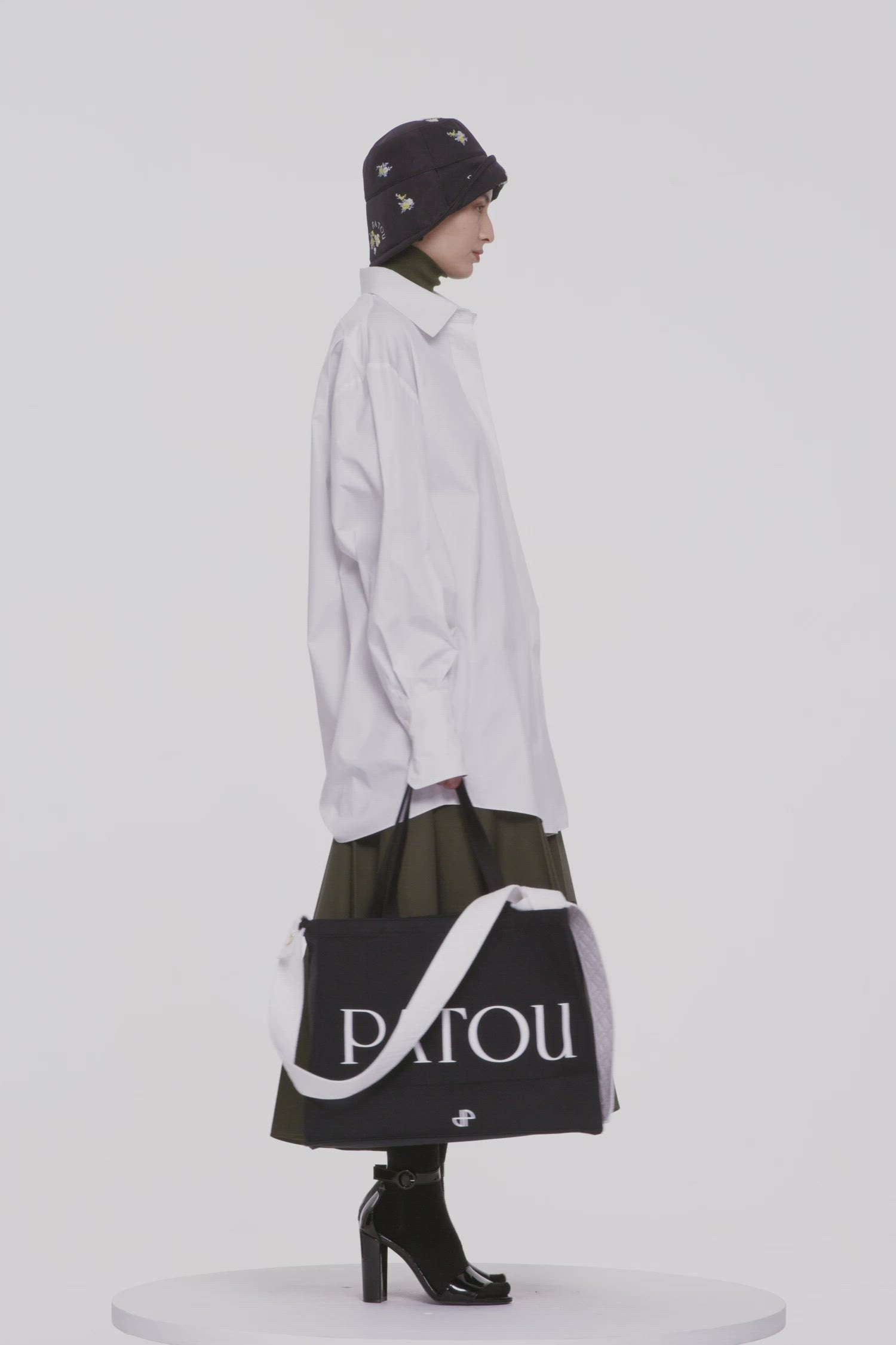 Patou - Mini shirt dress in organic cotton - White - Long shirt or short dress? There are two sides to every Patou story!White organic cotton dress. Short hemline. Concealed button fastening. Patou logo embroidered at the front. Buttoned cuffs.  Loose fit (select one size down for a fitted look).